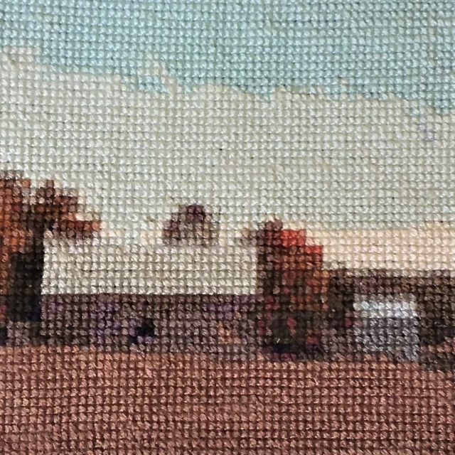 Fall on the Farm, counted cross stitch 300 × 79 on 18ct Aida fabric. Approx 27 × 10.5 inches framed. Russet tones and golden fields set against a clear autumn sky define this detail of a farmscape near Picton, Ontario.