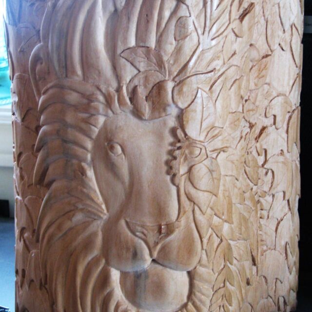 Hiding in the Trees, hand-carved leafy lion log