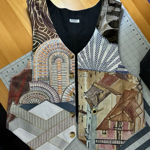 This custom vest was created for an architect using materials from old, discarded, and discontinued fabric swatches for furniture.