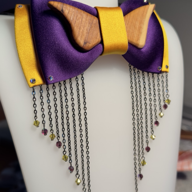 Flying GALA 1 - This bow tie was created for a client attending a gala, combining materials to match the client's suit, repurposing wood from a fallen tree, and incorporating Swarovski glass crystals.