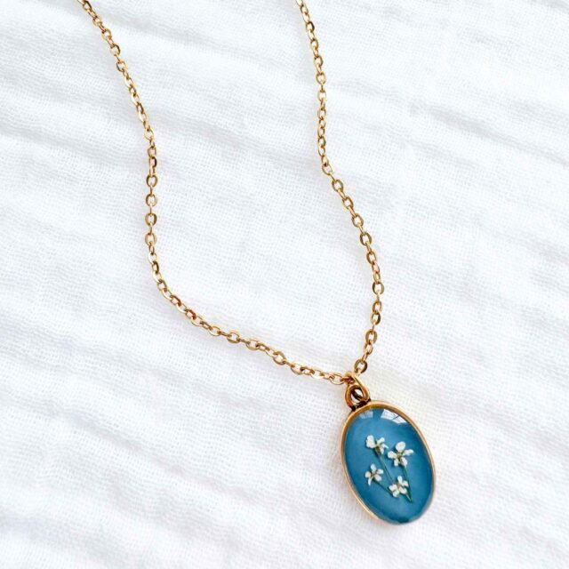 Handmade dainty pressed flower pendant necklace by Studio Chelsea.