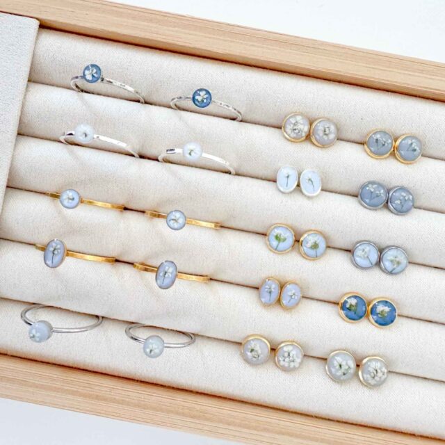 Handmade dainty pressed flower rings and stud earrings by Studio Chelsea.