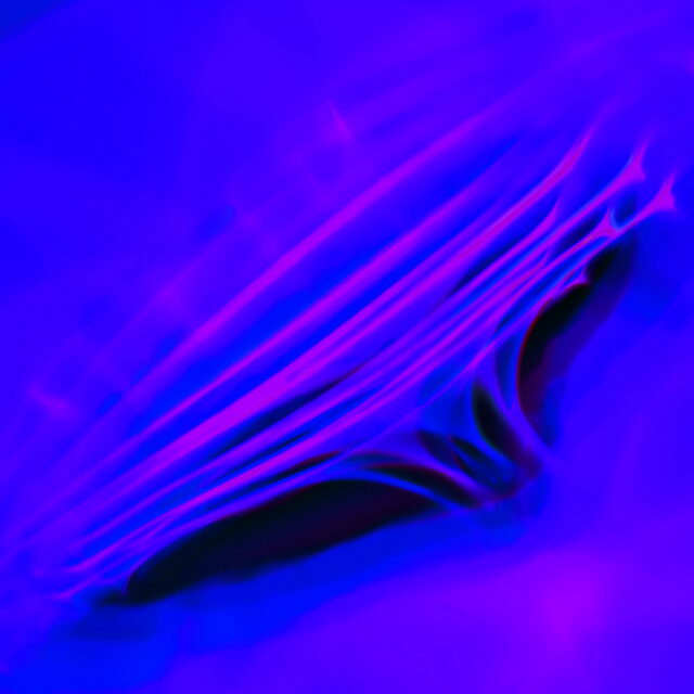 Topsy-Turvy, sideview of underlit oils mixing